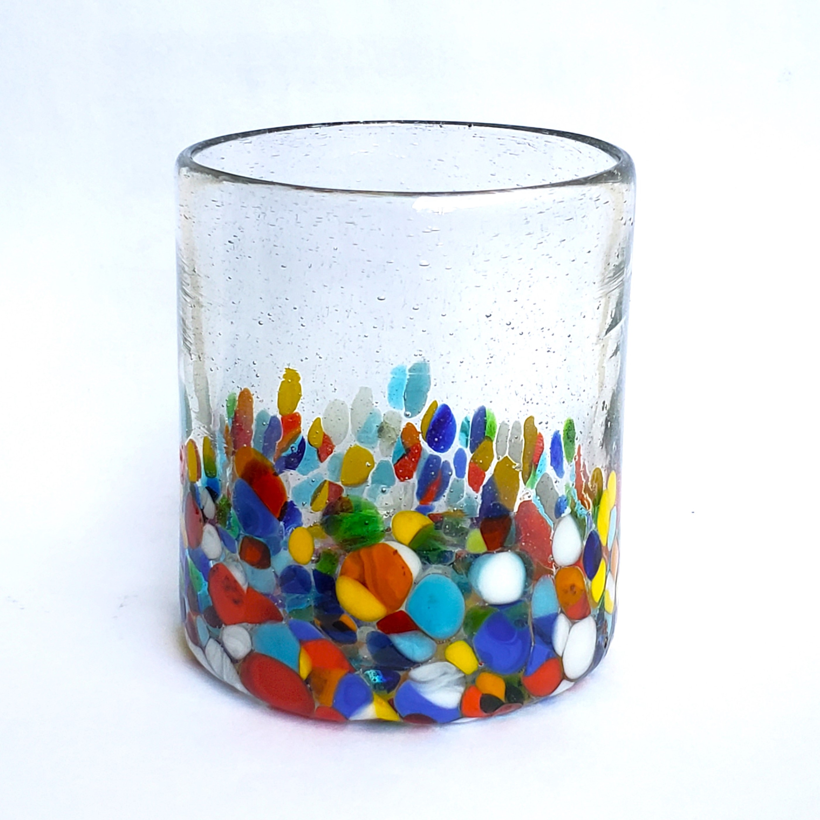 Vasos de Vidrio Soplado al Mayoreo / fetti 9 oz Short Tumblers (set of 6) / Our Clear & Confetti Glassware combines the best of two worlds: clear, thick, sturdy handcrafted glass on top, meets the colorful, festive, confetti bottom! These glasses will sure be a standout in any table setting or as a fabulous gift for your loved ones. Crafted one by one by skilled artisans in Tonala, Mexico, each glass is different from the next making them unique works of art. You'll be amazed at how they make having a simple glass of water a happier experience. Made from eco-friendly recycled glass.